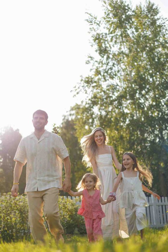 family enjoying a relaxed mother’s day appreciation moment together outdoors with simple shared time